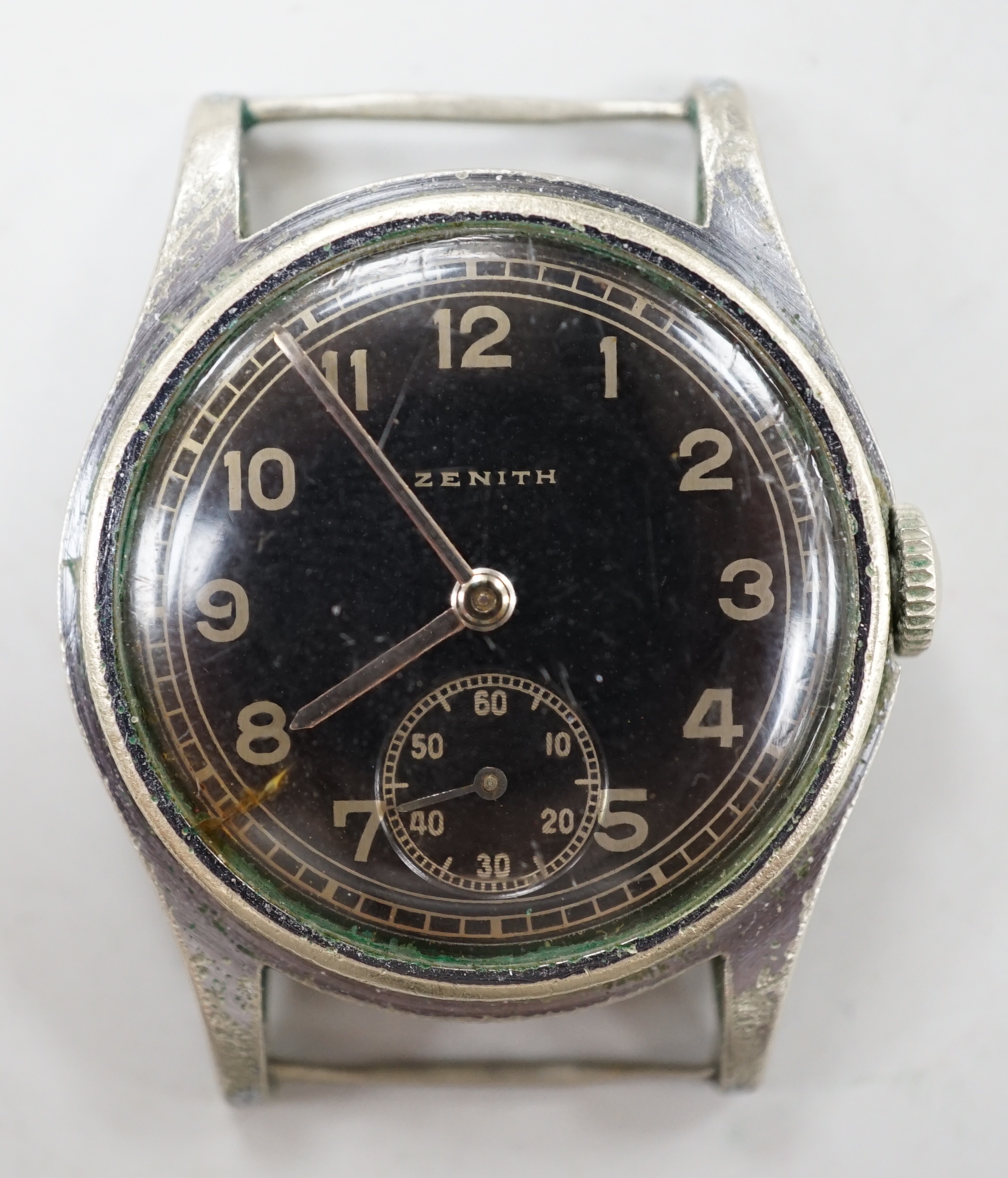 A 1930's/1940's? stainless steel Zenith black dial manual wind wrist watch, case diameter 30mm, no strap.